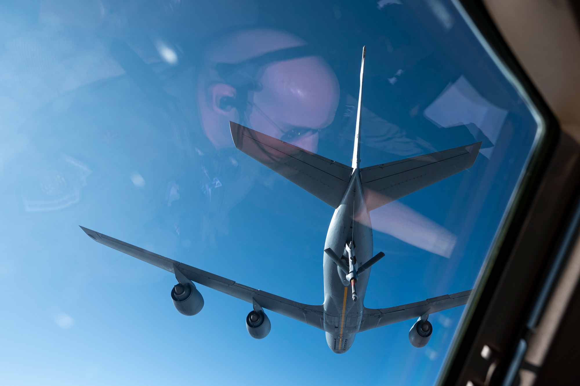 An airplane prepares to refuel another airplane.