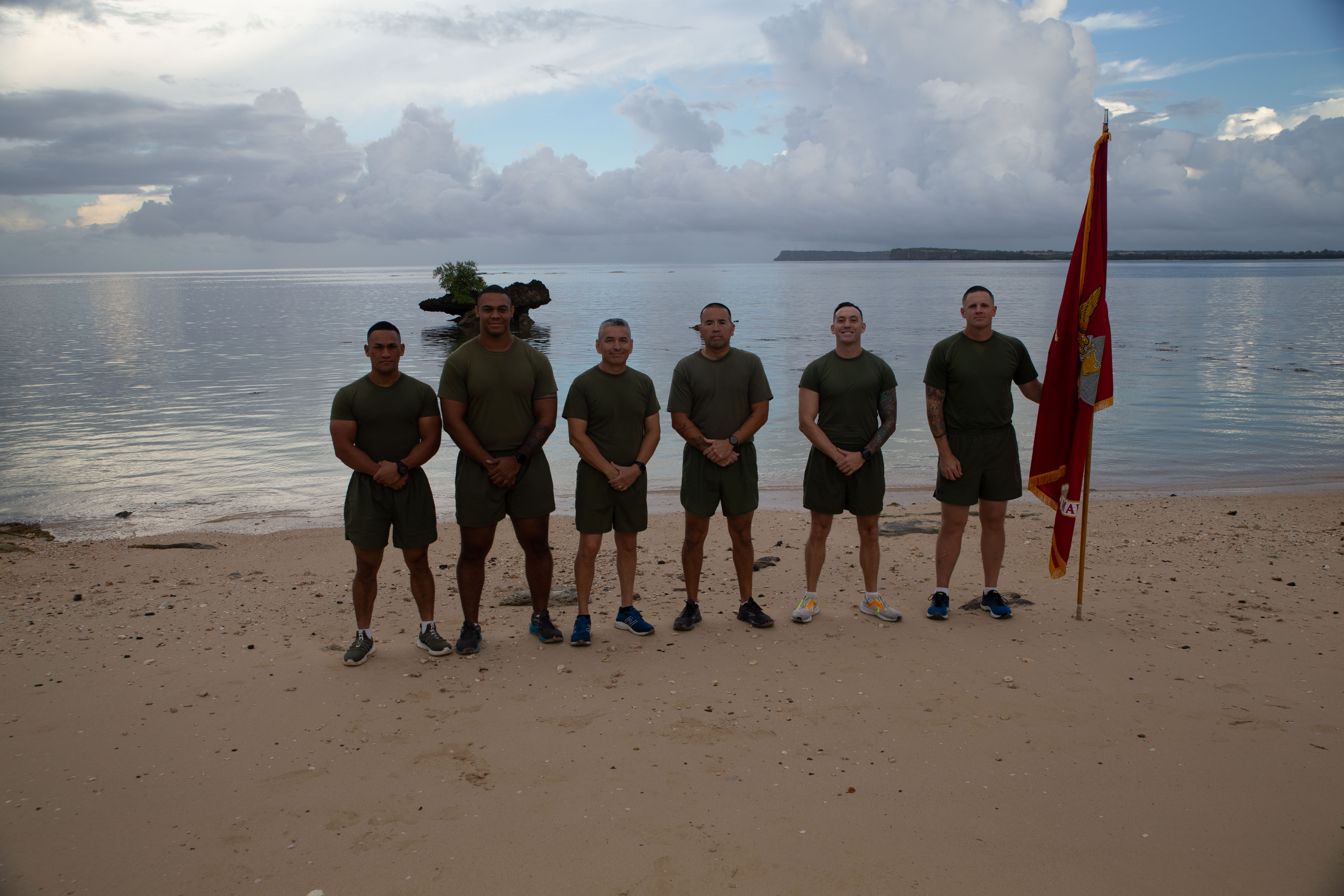 U.S. Marines with Marine Corps Base Camp Blaz, pose for a group photo before a 249-mile run as a part of a celebration of the upcoming Marine Corps Birthday, at Agat Landing Beach, Agat, Nov. 6, 2024. To celebrate the Marine Corps’ 249th Birthday, Marine Corps Base Camp Blaz collectively ran 249 miles during a 24-hour period, symbolizing the commitment to excellence, endurance, and the unbreakable bond that unites the Marines. This event concluded on Nov. 7 with the Marine Corps 249th Birthday Cake Cutting ceremony. (U.S. Marine Corps photo by Lance Cpl. Afton Smiley)