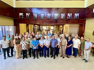 U.S. Coast Guard representatives, including Capt. Worst, Lt. Cmdr. Derek Wallin, maritime advisor, and Lt. Anna Maria Vaccaro, Compact of Free Association liaison, from U.S. Coast Guard Forces Micronesia/Sector Guam (FM/SG) join U.S. and Marshallese colleagues for a photo in Majuro, Republic of the Marshall Islands on Oct. 17, 2024.