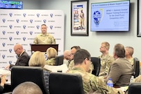 Airmen giving a briefing during AFIMSC IWEPTAC event to leadership.