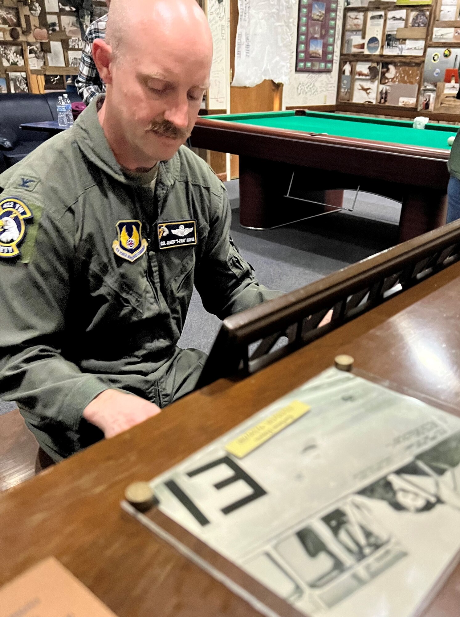 Col. James Hayes, 412th Test Wing deputy commander, plays his grandmother’s piano after its dedication in Pancho’s Lounge.