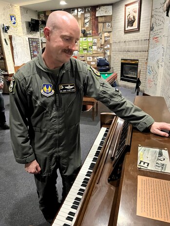 Col. James Hayes looks at the final product on his grandmother’s piano.
