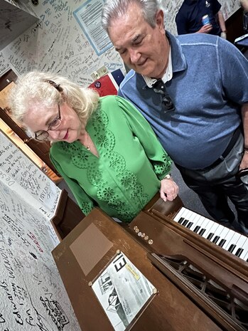 Terri Hayes and husband James look at the newly installed dedication plaque and photo of James’ mother.