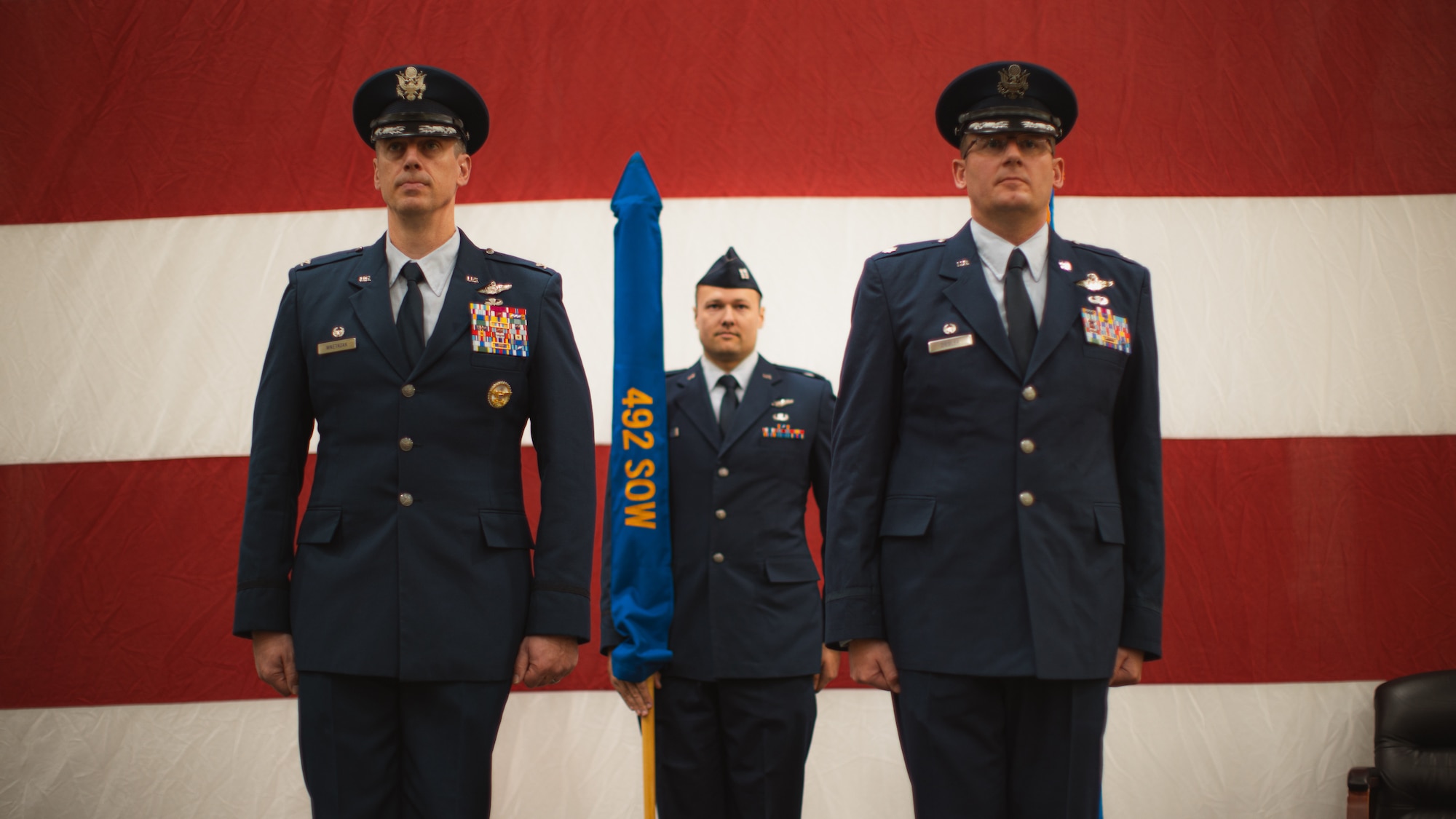 Photo  of Col. Patrick Wnetrzak, 492d Special Operations Wing commander, and Lt. Col. Jesse Ziegler, 17th Special Operations Squadron commander, at a ceremony.
