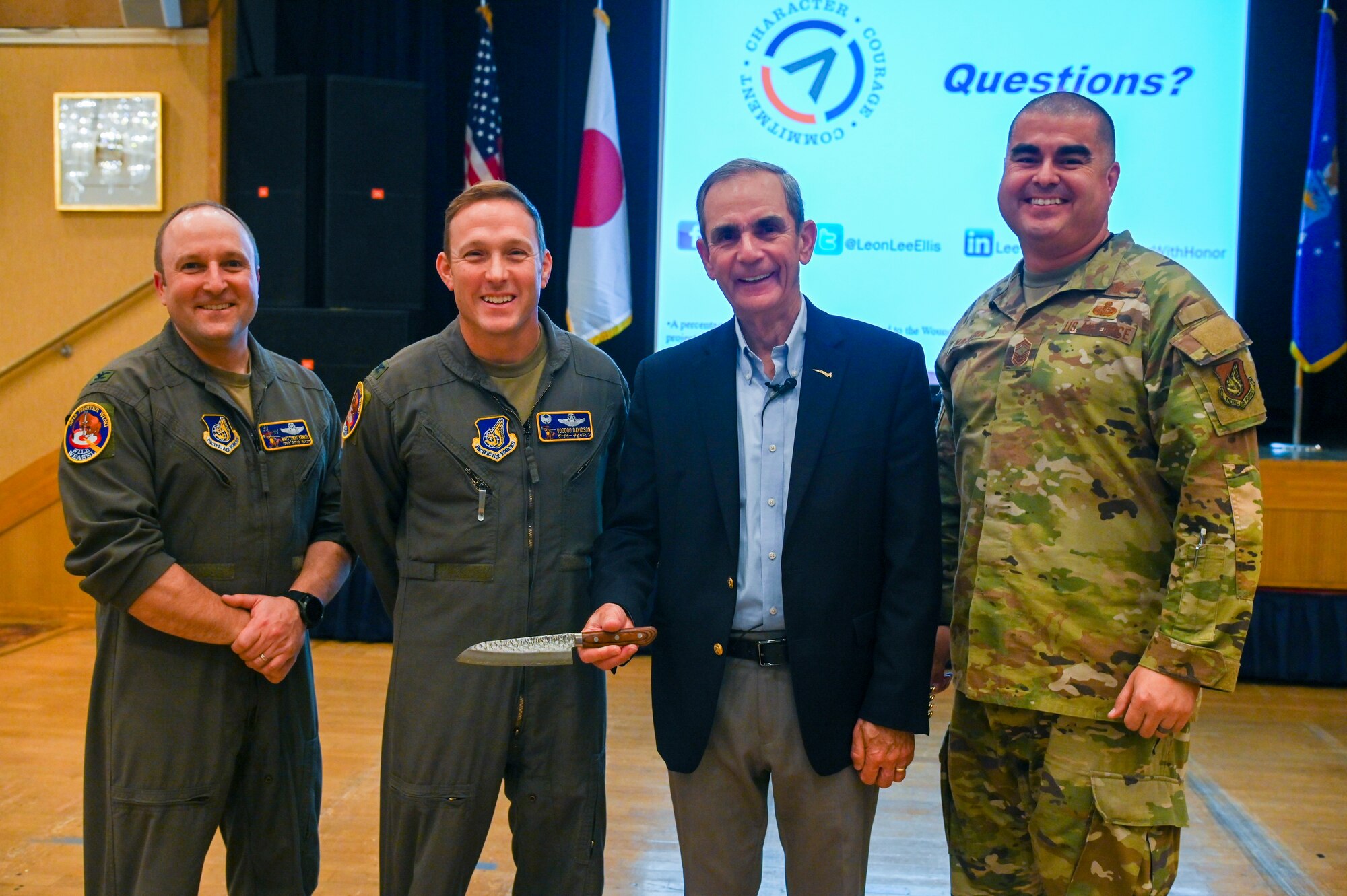 U.S. Air Force retired Col. Lee Ellis, center right, former Vietnam War pilot and prisoner of war, poses with the 35th Fighter Wing leadership after a presentation at Misawa Air Base, Japan, Nov. 15, 2024.
