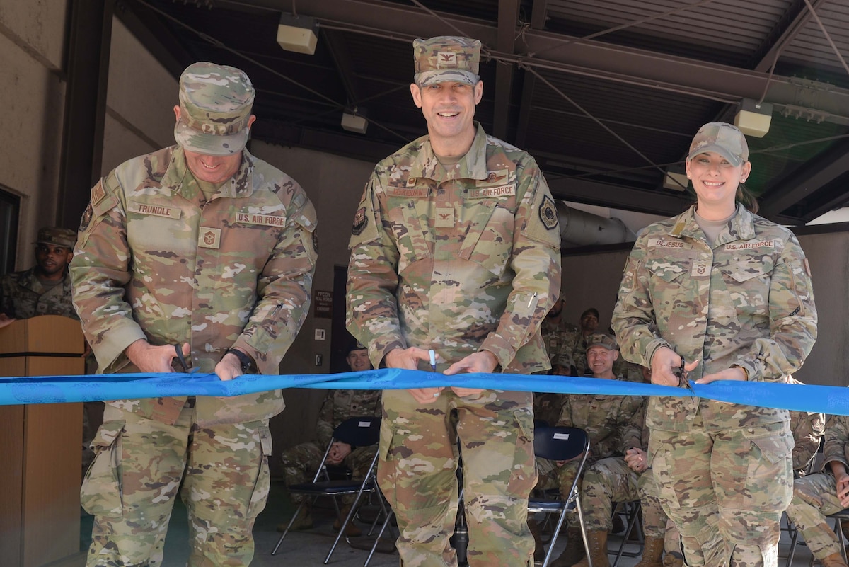 From left, U.S. Air Force Chief Master Sgt. Joshua S. Trundle, 51st Fighter Wing command chief, Col. William McKibban, 51st FW commander, and Senior Master Sgt. Emily Dejesus, 51st Civil Engineer Squadron first sergeant, cut a ribbon at the new Airman’s Attic at Osan Air Base, Republic of Korea, Oct. 23, 2024. The ribbon cutting ceremony signifies the grand opening of the new Airman’s Attic location. (U.S. Air Force photo by Staff Sgt. Kahdija Slaughter)