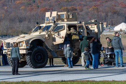 U.S. Soldiers and Airmen with the Pennsylvania National Guard engage with members of the local community during an open house at Fort Indiantown Gap, Pennsylvania, Nov. 16, 2024. This free event featured Miss Pennsylvania, live tactical demonstrations, flyovers, displays of military equipment and vehicles, food trucks, live music and a performance by the Pennsylvania National Guard’s Ambassador Demonstration Team. (U.S. Army National Guard photo by Wayne V. Hall)