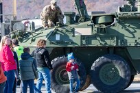 U.S. Soldiers and Airmen with the Pennsylvania National Guard engage with members of the local community during an open house at Fort Indiantown Gap, Pennsylvania, Nov. 16, 2024. This free event featured Miss Pennsylvania, live tactical demonstrations, flyovers, displays of military equipment and vehicles, food trucks, live music and a performance by the Pennsylvania National Guard’s Ambassador Demonstration Team. (U.S. Army National Guard photo by Wayne V. Hall)