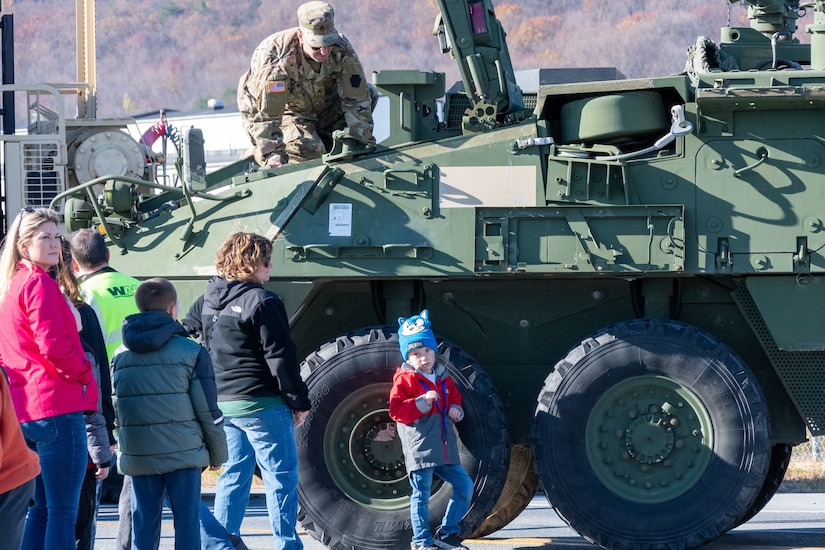 U.S. Soldiers and Airmen with the Pennsylvania National Guard engage with members of the local community during an open house at Fort Indiantown Gap, Pennsylvania, Nov. 16, 2024. This free event featured Miss Pennsylvania, live tactical demonstrations, flyovers, displays of military equipment and vehicles, food trucks, live music and a performance by the Pennsylvania National Guard’s Ambassador Demonstration Team. (U.S. Army National Guard photo by Wayne V. Hall)