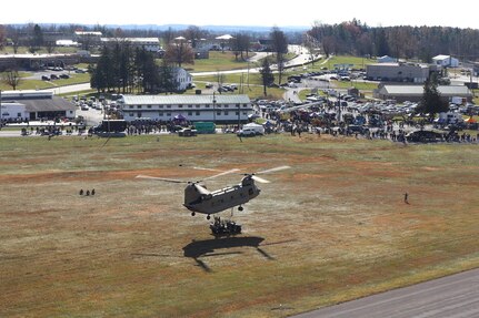 U.S. Soldiers and Airmen with the Pennsylvania National Guard engage with members of the local community during an open house at Fort Indiantown Gap, Pennsylvania, Nov. 16, 2024. This free event featured Miss Pennsylvania, live tactical demonstrations, flyovers, displays of military equipment and vehicles, food trucks, live music and a performance by the Pennsylvania National Guard’s Ambassador Demonstration Team. (U.S. Army National Guard photo by Cadet Jessica Barb)