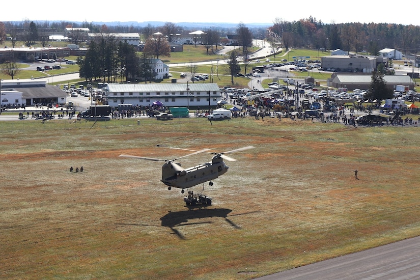 U.S. Soldiers and Airmen with the Pennsylvania National Guard engage with members of the local community during an open house at Fort Indiantown Gap, Pennsylvania, Nov. 16, 2024. This free event featured Miss Pennsylvania, live tactical demonstrations, flyovers, displays of military equipment and vehicles, food trucks, live music and a performance by the Pennsylvania National Guard’s Ambassador Demonstration Team. (U.S. Army National Guard photo by Cadet Jessica Barb)