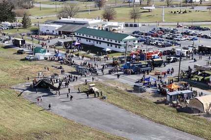 U.S. Soldiers and Airmen with the Pennsylvania National Guard engage with members of the local community during an open house at Fort Indiantown Gap, Pennsylvania, Nov. 16, 2024. This free event featured Miss Pennsylvania, live tactical demonstrations, flyovers, displays of military equipment and vehicles, food trucks, live music and a performance by the Pennsylvania National Guard’s Ambassador Demonstration Team. (U.S. Army National Guard photo by Cadet Jessica Barb)