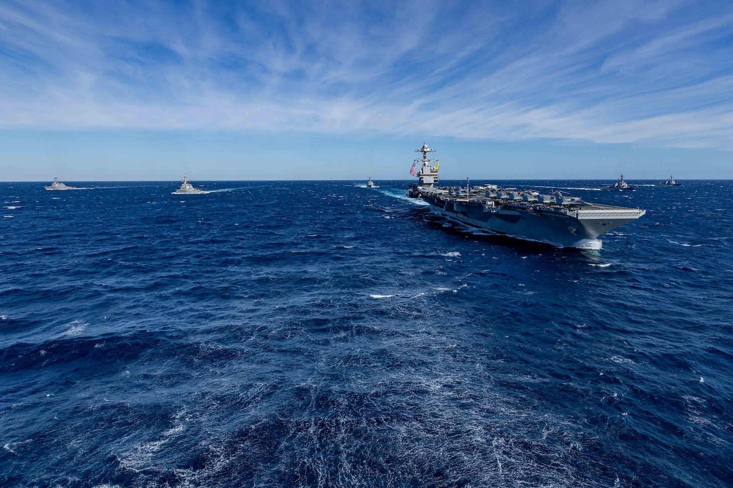 The world's largest aircraft carrier, USS Gerald R. Ford (CVN 78), sails in formation with the Arleigh Burke-class guided missile destroyers USS Winston Churchill (DDG 81), USS Mitscher (DDG 57), USS Mahan (DDG 72), USS Bainbridge (DDG 96), and USS Forrest Sherman (DDG 98) in the Atlantic Ocean, Nov. 12, 2024.