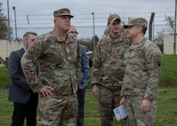 U.S. Air Force Brig. Gen. Patrick Miller, Air Force Civil Engineer Center commander, Joint Base San Antonio-Lackland, Texas, talks with service members at Royal Air Force Mildenhall, England, Nov. 14, 2024. Miller attended meetings about RAF Mildenhall’s current infrastructure needs and requirements. (U.S. Air Force photo by Senior Airman Nash Truitt)