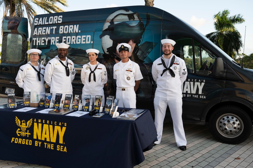 SUNRISE, Fla. (Nov. 12, 2024) Sailors attached to Navy Talent Acquisition Group (NTAG) Miami speak about the Navy with game spectators in support of the Florida Panthers’ Salute to Service game night at the Amerant Bank Arena in Sunrise, Florida, Nov. 12, 2024. NTAG Miami has 38 recruiting locations throughout South Florida, Puerto Rico and the Virgin Islands, with the combined mission to recruit the highest caliber Sailors to meet the needs of the fleet. (U.S. Navy photo by Mass Communication Specialist 1st Class Natalia Murillo)