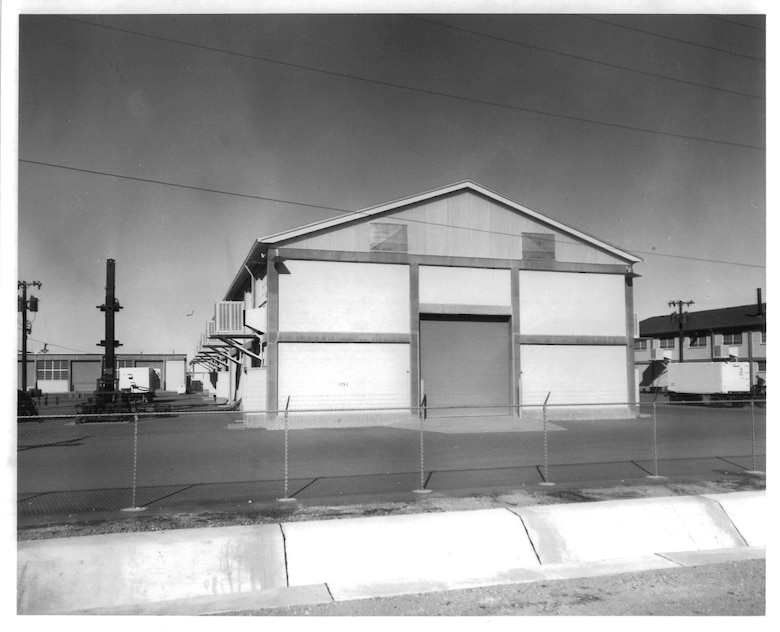 A southern view of building 1093 on Fort Bliss, Texas circa 1962 when it housed two Nike Hercules surface-to-air missile laboratories and classrooms. The launch rack on the left and radar trailers on the right link the missile system to the building. Building 1093 has been a part of the Army’s Air Defense Artillery since before the branch’s inception on June 20, 1968.