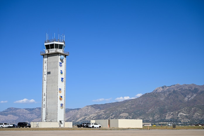 Air traffic tower in front of a mountain background
