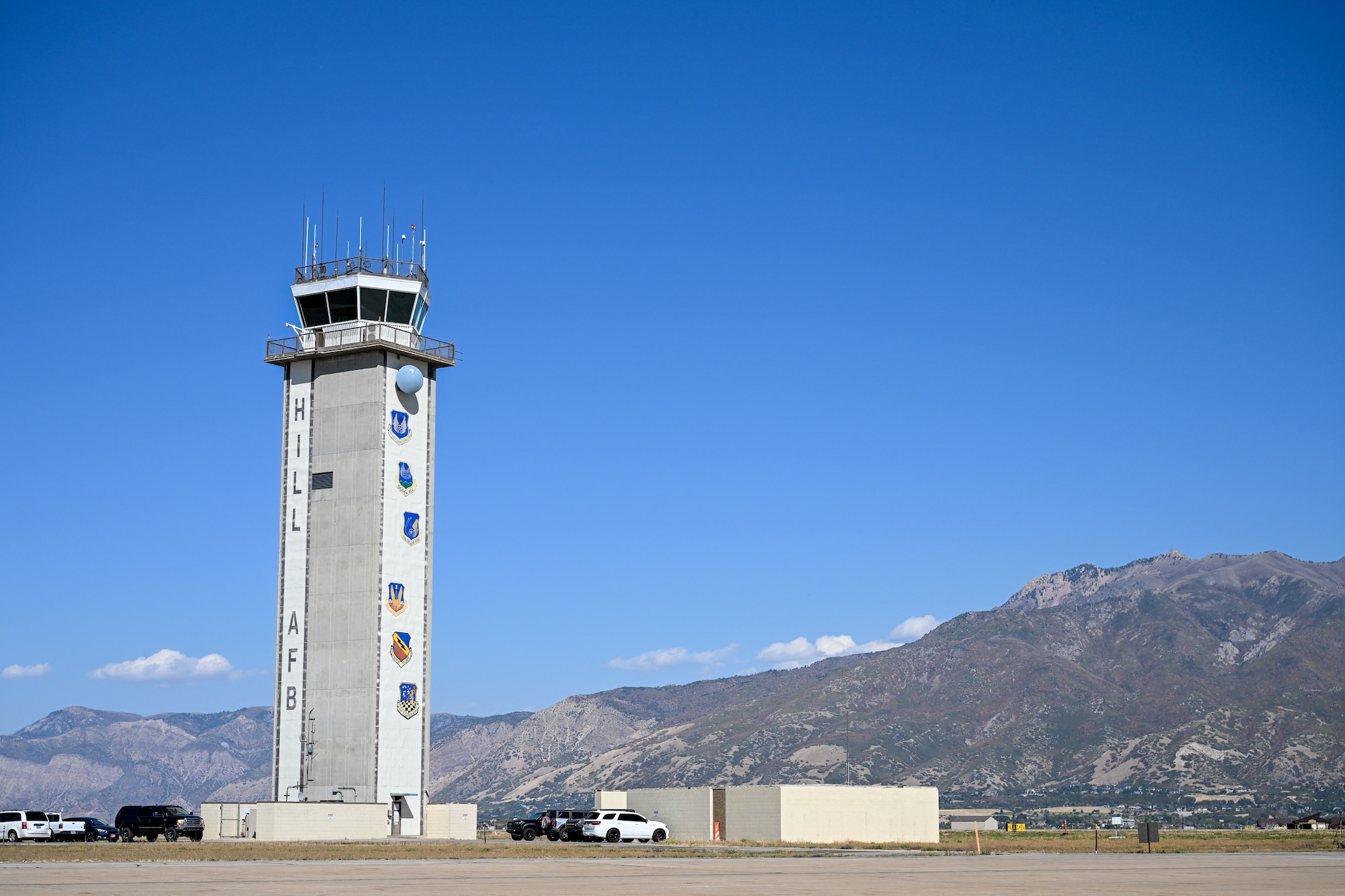 Air traffic tower in front of a mountain background