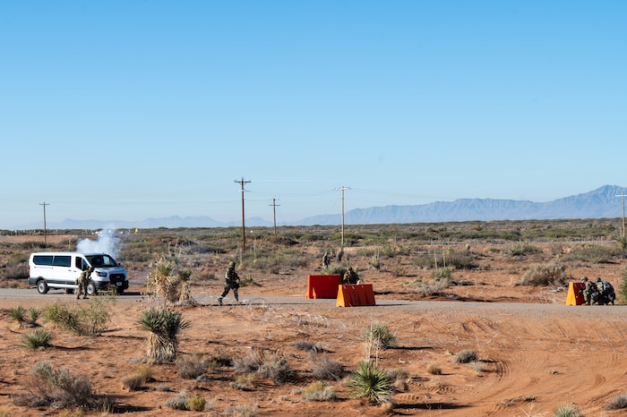 U.S. Airmen assigned to the 11th Air Task Force respond to a simulated attack at an entry control point during the 11th ATF’s first field exercise at McGregor Range, New Mexico, Nov. 9, 2024. Airmen received classroom and field training that culminated in a simulated base defense scenario. (U.S. Air Force photo by Airman 1st Class Jasmyne Bridgers-Matos)