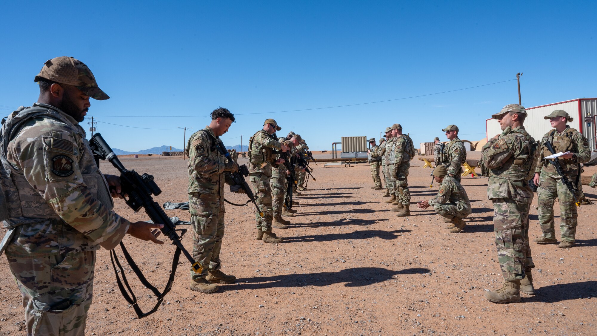 U.S. Air Force security forces Airmen assigned to the 11th Air Task Force conduct weapons familiarization and firing tactics training during the 11th ATF’s first field exercise at McGregor Range, New Mexico, Nov. 10, 2024. The training enabled Airmen of all experience levels to increase confidence and learn best practices before going to the firing range. (U.S. Air Force photo by Airman 1st Class Jasmyne Bridgers-Matos)