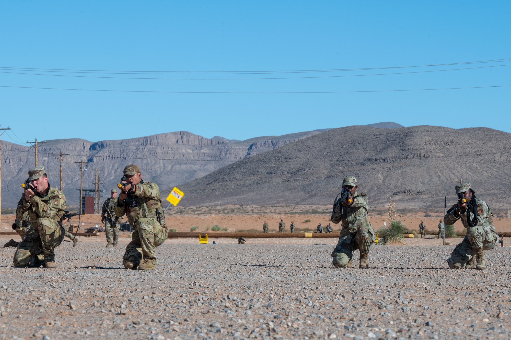 U.S. Airmen assigned to the 11th Air Task Force perform tactical movements during the 11th ATF’s first field exercise at McGregor Range, New Mexico, Nov. 10, 2024. Airmen split into pairs and took turns providing simulated cover fire so that the other pair could safely move into position. (U.S. Air Force photo by Airman 1st Class Jasmyne Bridgers-Matos