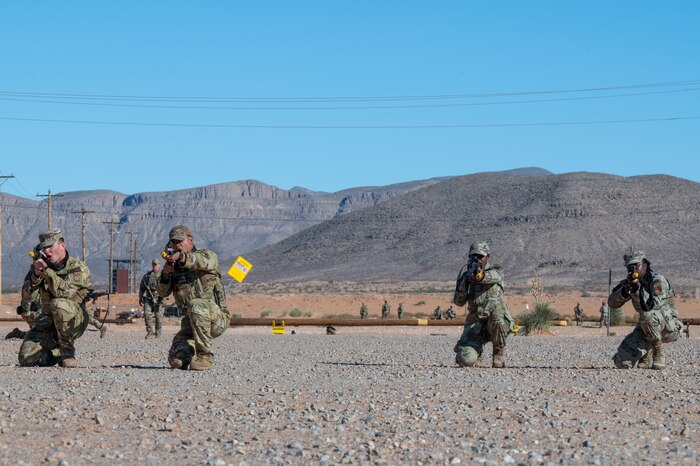 U.S. Airmen assigned to the 11th Air Task Force perform tactical movements during the 11th ATF’s first field exercise at McGregor Range, New Mexico, Nov. 10, 2024. Airmen split into pairs and took turns providing simulated cover fire so that the other pair could safely move into position. (U.S. Air Force photo by Airman 1st Class Jasmyne Bridgers-Matos