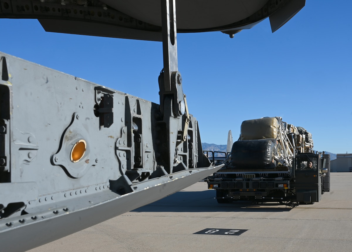 U.S. Air Force Airman 1st Class Emanuel Garcia, 355th Logistics Readiness Squadron air terminal function representative, delivers 49,500 pounds of cargo to a C-17 Globemaster III aircraft at Davis-Monthan Air Force Base, Arizona, Nov. 6, 2024. The U.S. Army Test and Evaluation Command and Combat Capabilities Development Command Soldier Center utilized the heavy load to test heavy airdrops in remote or austere locations in support of a US Transportation Command funded project. (U.S. Air Force photo by Staff Sgt. Abbey Rieves)