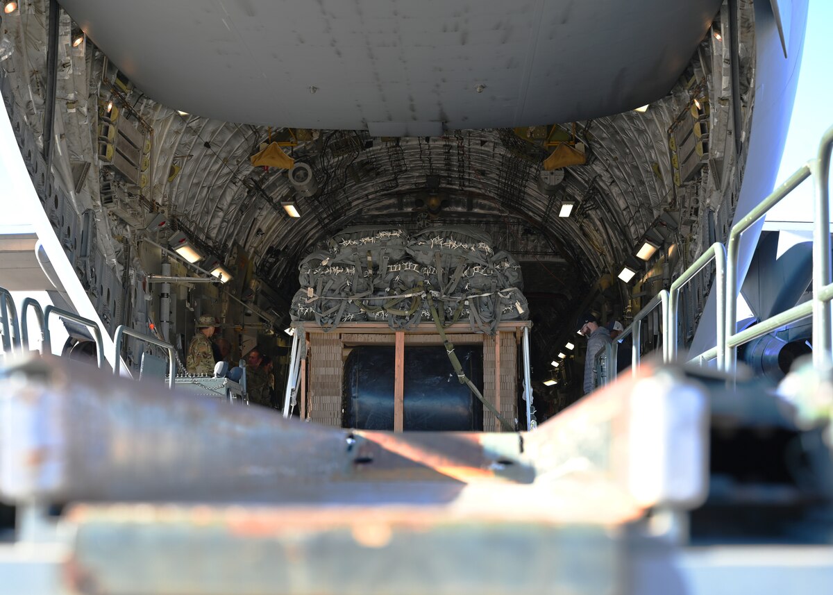 A 49,500 pound test cargo pallet is loaded into a C-17 Globemaster III aircraft at Davis-Monthan Air Force Base, Arizona, Nov. 6, 2024. The Air Force’s 16th Airlift Squadron and 355th Logistics Readiness Squadron worked with the United States Transportation Command, U.S. Army Combat Capabilities Development Command Soldier Center and U.S. Army Yuma Proving Ground to concept test the simulated airdropping of over 37,000 pounds of aircraft fuel in an austere environment. This multi-agency and joint collaboration advanced capabilities across the Department of Defense. (U.S. Air Force photo by Staff Sgt. Abbey Rieves)