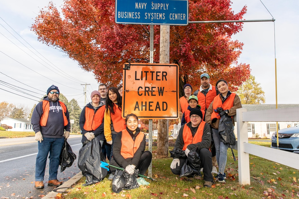 Sailors and civilians assigned to Naval Supply Systems Command (NAVSUP) Business Systems Center (BSC) remove trash and debris from a two-mile stretch of road on Sporting Hill Road in Mechanicsburg, Pa., November 15, as part of the Pennsylvania Department of Transportation state-wide Adopt a Highway program.