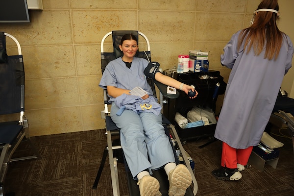 Seaman Apprentice Sofia Steddom, a corpsman in the Naval Hospital Camp Pendleton Family Medicine Department, donates blood during an Armed Services Blood Program – Camp Pendleton blood drive coordinated by the Navy Medicine Readiness and Training Command Camp Pendleton Junior Enlisted Association on Nov. 18, 2024, in the Naval Hospital Camp Pendleton Galley Meeting Room.