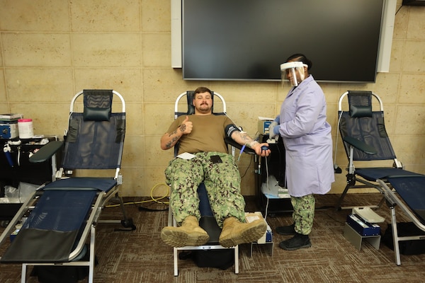 Petty Officer 3rd Class Gavin Simmons, a corpsman from the 13 Area Dental Clinic, donates blood during an Armed Services Blood Program – Camp Pendleton blood drive coordinated by the Navy Medicine Readiness and Training Command Camp Pendleton Junior Enlisted Association on Nov. 18, 2024, in the Naval Hospital Camp Pendleton Galley Meeting Room.