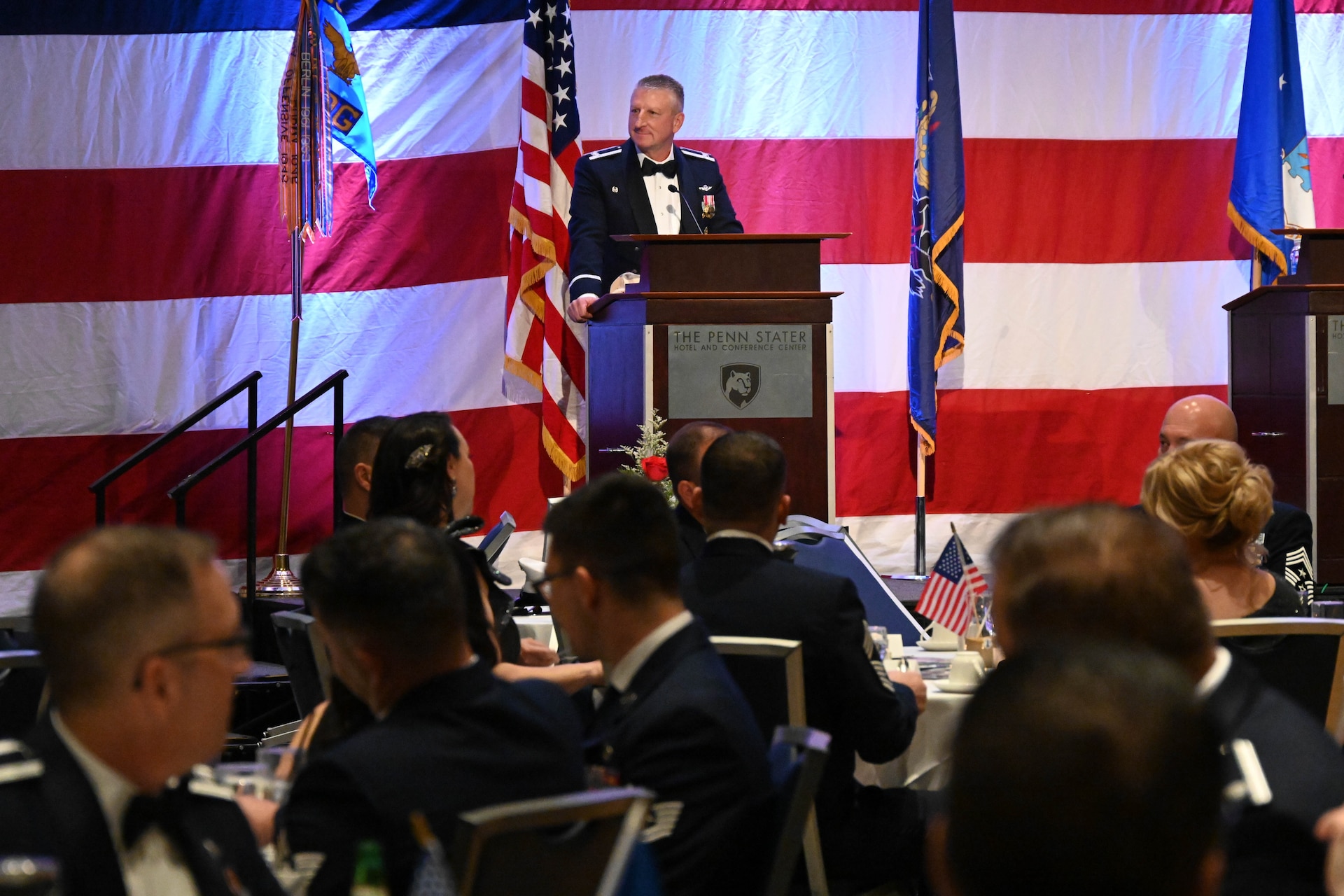 Nearly 250 attendees, including current and former members of the 193rd Air Operations Group, families and distinguished guests, gathered for the unit's 75th anniversary dining out at The Penn Stater Hotel and Conference Center in State College, Pa., Nov. 16, 2024. The event celebrated the unit’s transformation from its origins in a downtown State College garage to its vital role in global and local operations. Highlights of the evening included special presentations, ceremonial toasts and reflections on the group’s storied and enduring legacy. (U.S. Air Force photo by Tech. Sgt. Ted Nichols)