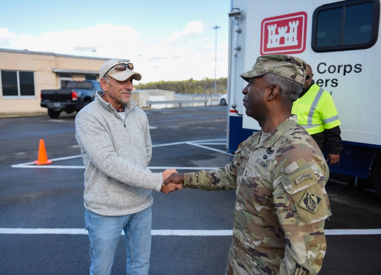 Maj. Gen. Jason E. Kelly, the Deputy Commanding General for Civil Works and Emergency Operations (right),  recognizes Jerry Breznican, Nashville District chief of Emergency Management, for his team's ongoing efforts in the Hurricane Helene response in East Tennessee, druing a visit to the district on Nov. 14, 2024. The Nashville District's emergency management team has been vital in coordinating USACE's response to the Hurricane Helene effected area in East Tennessee through the management of funding, processing taskers and providing continuous logistical support for deployed USACE responders.
