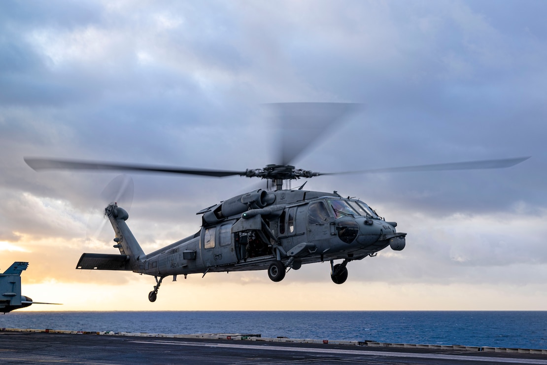 241116-N-KA812-1050 NORTH SEA (Nov. 16, 2024) An MH-60S Sea Hawk helicopter, attached to the "Dragonslayers" of Helicopter Sea Combat Squadron (HSC) 11, takes off from the flight deck of the Nimitz-class aircraft carrier USS Harry S. Truman (CVN 75), Nov. 16. USS Harry S. Truman, the flagship of the Harry S. Truman Carrier Strike Group (HSTCSG), is on a scheduled deployment in the U.S. 6th Fleet area of operations supporting U.S. Naval Forces Europe-Africa to defend U.S., Allied and partner interests. (U.S. Navy Photo by Mass Communication Specialist 3rd Class Logan Nystrand)