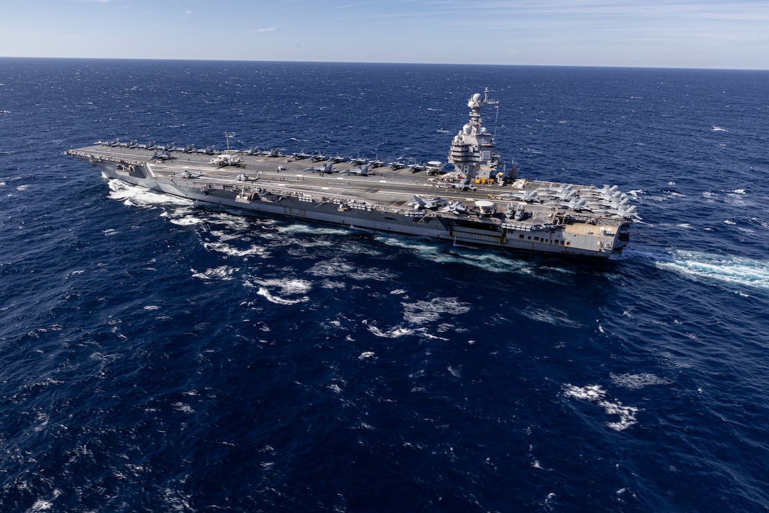 The world's largest aircraft carrier, USS Gerald R. Ford steams in the Atlantic Ocean, Nov. 12, 2024. The Gerald R. Ford Carrier Strike Group is underway in the Atlantic Ocean completing Group Sail. Group Sail is the first at-sea integrated phase training event during a routine deployment training cycle. It is designed to challenge the Gerald R. Ford CSG’s ability to use the capabilities of the USS Gerald R. Ford (CVN 78), USS Winston S. Churchill (DDG 81), Carrier Air Wing (CVW) 8, Destroyer Squadron (DESRON) 2, and embarked Information Warfare team as a cohesive Strike Group to meet Navy and Joint Warfighting requirements that increases warfighting capability and tactical proficiency across all domains. (U.S. Navy photo by Mass Communication Specialist 2nd Class Jacob Mattingly)