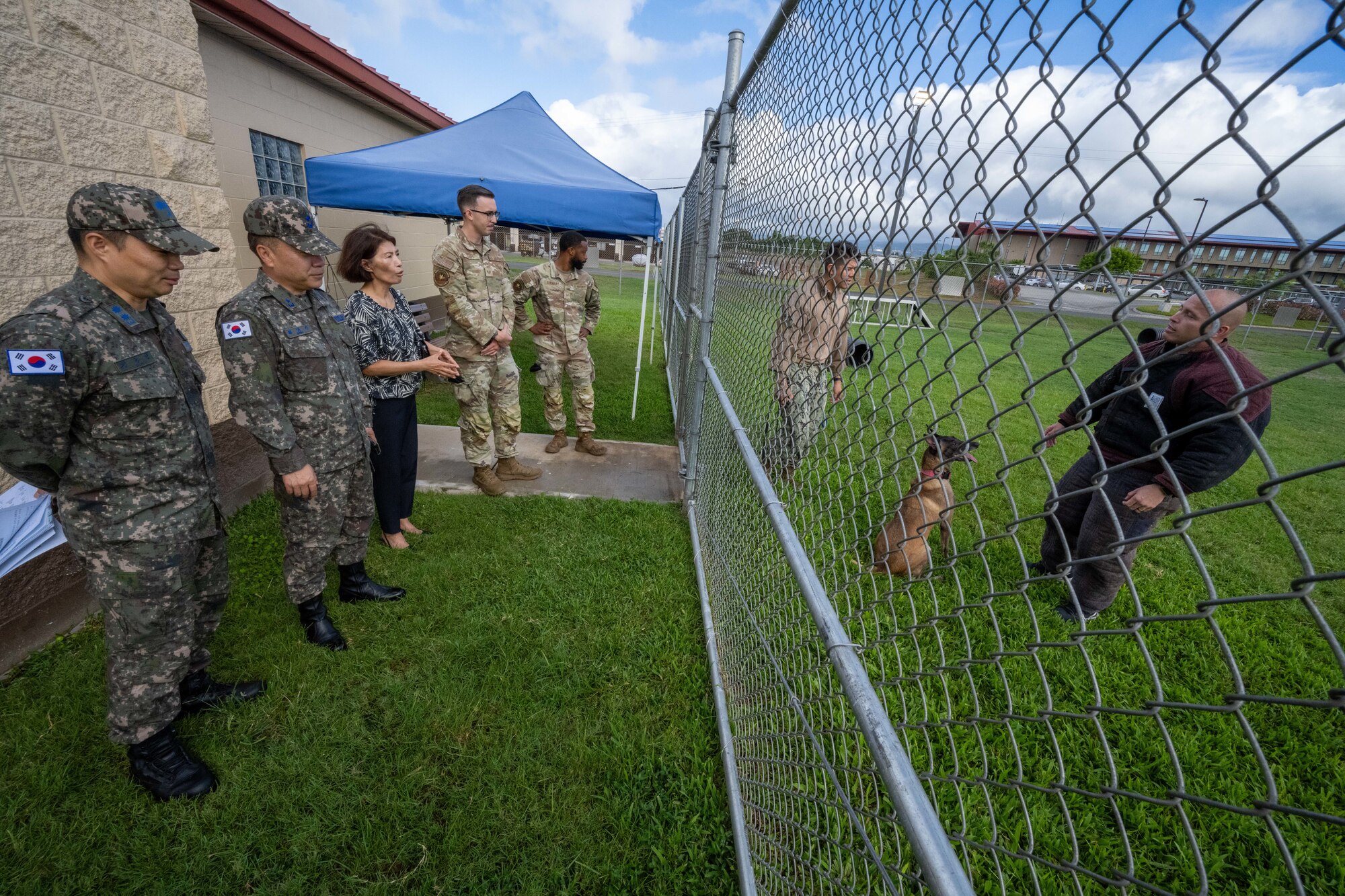 Photo of security forces Airmen showing K-9 units to visitors