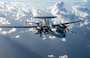 A U.S. Navy E-2D Advanced Hawkeye aircraft assigned to the VAW-121 Bluetails prepares to receive fuel from an HC-130J Combat King II aircraft during a fixed-wing air-to-air refueling training mission conducted by the 39th Rescue Squadron over the coast of Florida, Oct. 22, 2024. FWAAR enables aircraft to refuel at higher altitudes, extending mission range and endurance during critical operations. (U.S. Air Force photo by Tech. Sgt. Darius Sostre-Miroir)