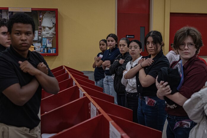 New U.S. Marine Corps recruits with Echo Company, 2nd Recruit Training Battalion, receive their contraband brief as part of a receiving event at Marine Corps Recruit Depot San Diego, California, Nov. 4, 2024. During the receiving process, recruits are checked for contraband, given a haircut, make a scripted phone calls home, and issued their gear required for training. (U.S. Marine Corps photo by Lance Cpl. Jacob B. Hutchinson)