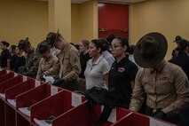 U.S. Marine Corps drill instructors with Receiving Company, Support Training Battalion, search the belongings of the new recruits for contraband as part of a receiving event for Echo Company, 2nd Recruit Training Battalion, at Marine Corps Recruit Depot San Diego, California, Nov. 4, 2024. During the receiving process, recruits are checked for contraband, given a haircut, make a scripted phone calls home, and issued their gear required for training. (U.S. Marine Corps photo by Lance Cpl. Jacob B. Hutchinson)