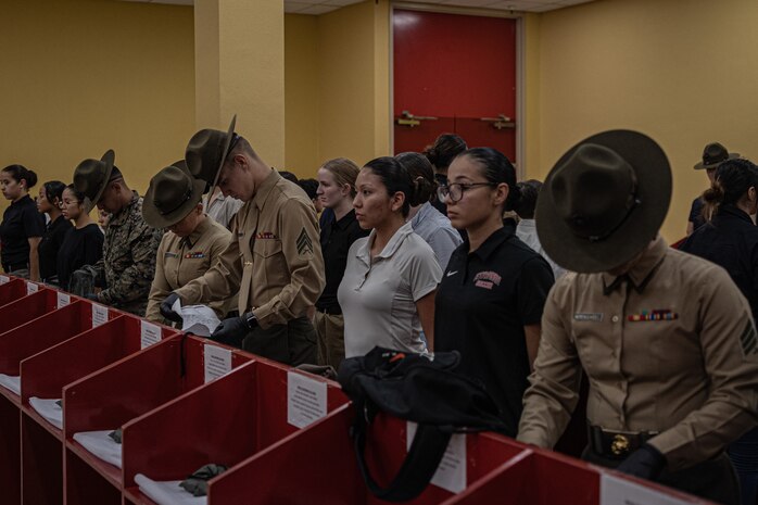 U.S. Marine Corps drill instructors with Receiving Company, Support Training Battalion, search the belongings of the new recruits for contraband as part of a receiving event for Echo Company, 2nd Recruit Training Battalion, at Marine Corps Recruit Depot San Diego, California, Nov. 4, 2024. During the receiving process, recruits are checked for contraband, given a haircut, make a scripted phone calls home, and issued their gear required for training. (U.S. Marine Corps photo by Lance Cpl. Jacob B. Hutchinson)