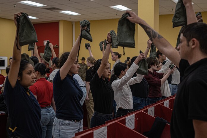 New U.S. Marine Corps recruits with Echo Company, 2nd Recruit Training Battalion, receive their contraband brief as part of a receiving event at Marine Corps Recruit Depot San Diego, California, Nov. 4, 2024. During the receiving process, recruits are checked for contraband, given a haircut, make a scripted phone calls home, and issued their gear required for training. (U.S. Marine Corps photo by Lance Cpl. Jacob B. Hutchinson)