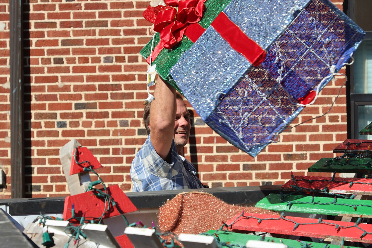 A U.S. Army Engineer Research and Development Center (ERDC) team member secures a trailer filled with festive decorations, ready to bring the magic of ERDC Under Lights to life on Dec. 5-6