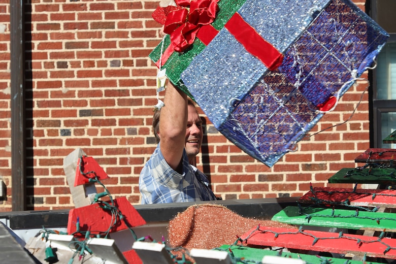 A U.S. Army Engineer Research and Development Center (ERDC) team member secures a trailer filled with festive decorations, ready to bring the magic of ERDC Under Lights to life on Dec. 5-6