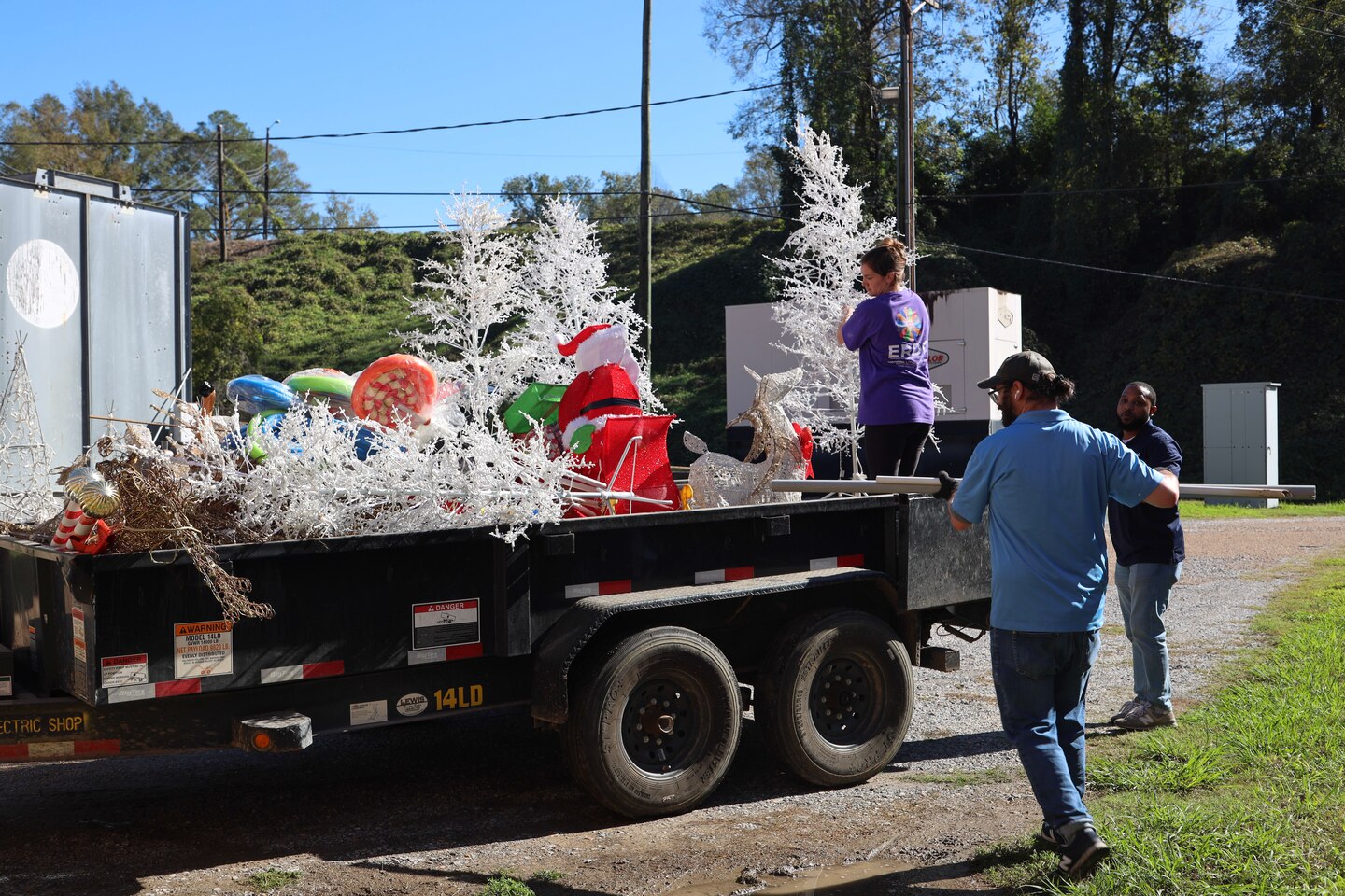 U.S. Army Engineer Research and Development Center (ERDC) team members load holiday decorations, preparing to light up the season at the ERDC Under Lights event on Dec. 5-6