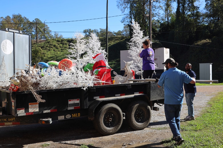 U.S. Army Engineer Research and Development Center (ERDC) team members load holiday decorations, preparing to light up the season at the ERDC Under Lights event on Dec. 5-6