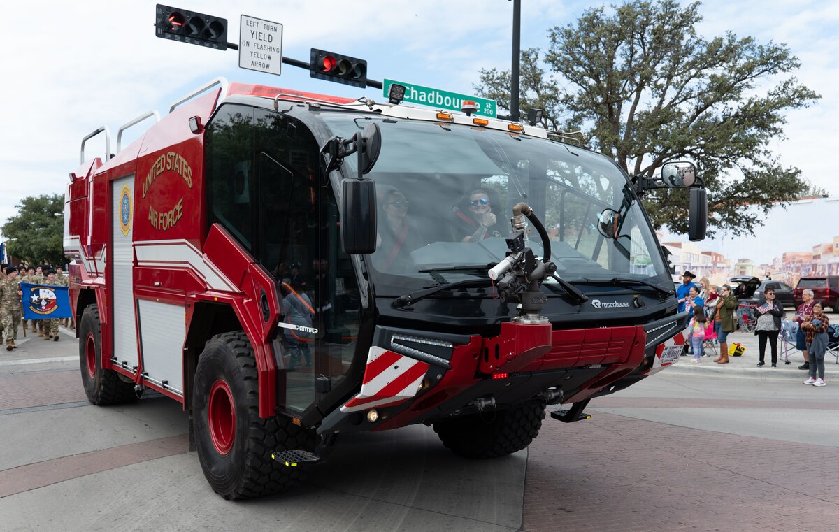 Personnel assigned to the 312th Training Squadron drive a Rosenbauer Panther firetruck at the Veterans Day Parade in San Angelo, Texas, Nov. 9, 2024. The Louis F. Garland Department of Defense Fire Academy has a fleet of fire trucks with different equipment and firefighting capabilities. (U.S. Air Force photo by Staff Sgt. Nathan Call)