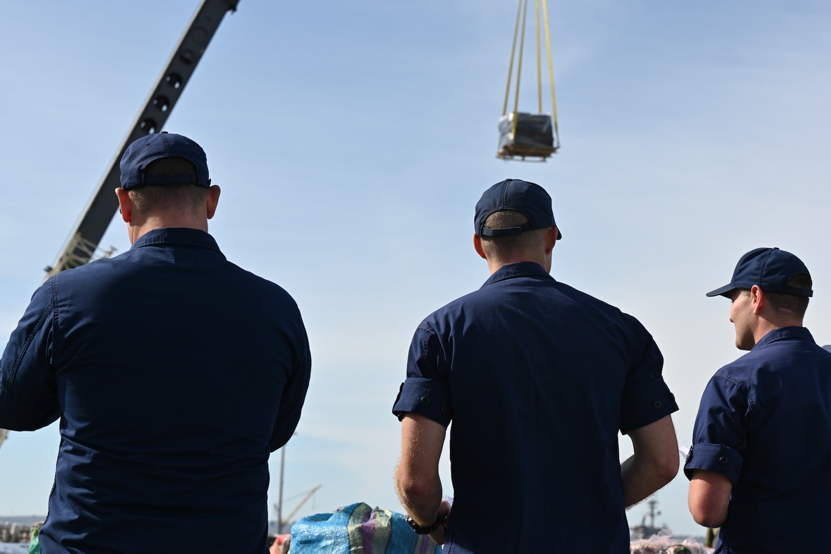 A U.S. Coast Guard Cutter Munro (WMSL 755) crewmembers oversee the offload of contraband from the Munro while moored in San Diego, Nov. 19, 2024. The offload is a result of eleven separate suspected drug smuggling vessel interdictions or events off the coasts of Mexico and Central and South America by the Coast Guard Cutters Munro, Vigorous, Hamilton, and the USS St. Louis in September and October. U.S. Coast Guard photo by Petty Officer 3rd Class Austin Wiley.