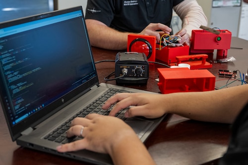Senior Airman Douglas Vargas, 22nd Air Refueling Wing Innovation Lab intern, works on the KC-46A Pegasus Auxiliary Power Unit Start System (APRUSS) at McConnell Air Force Base, Kansas, Nov. 14, 2024. Vargas, with an IT background, focused on the software and coding for the APRUSS. (U.S. Air Force photo by Airman 1st Class Paula Arce).