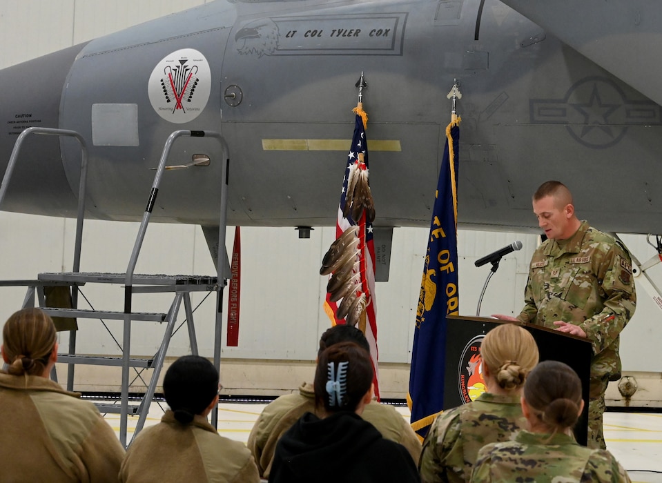 Military member gives a speech from behind a podium.