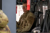 A man sitting in a helicopter.